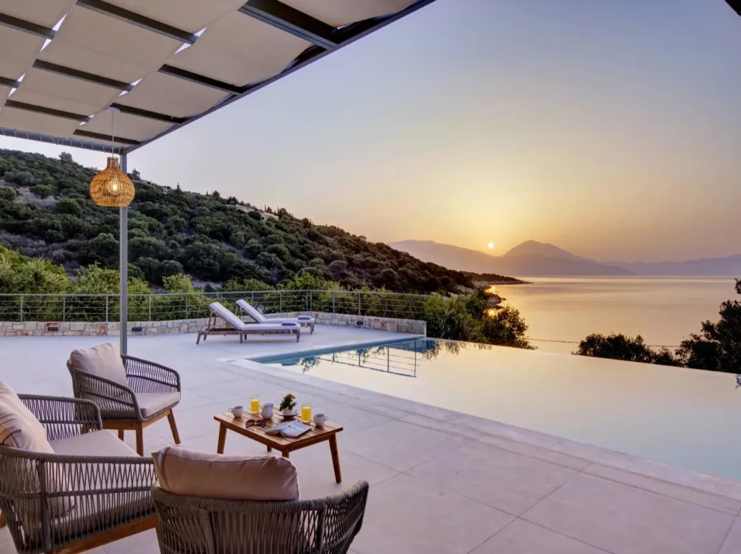 Sunrise over the infinity pool at Astir