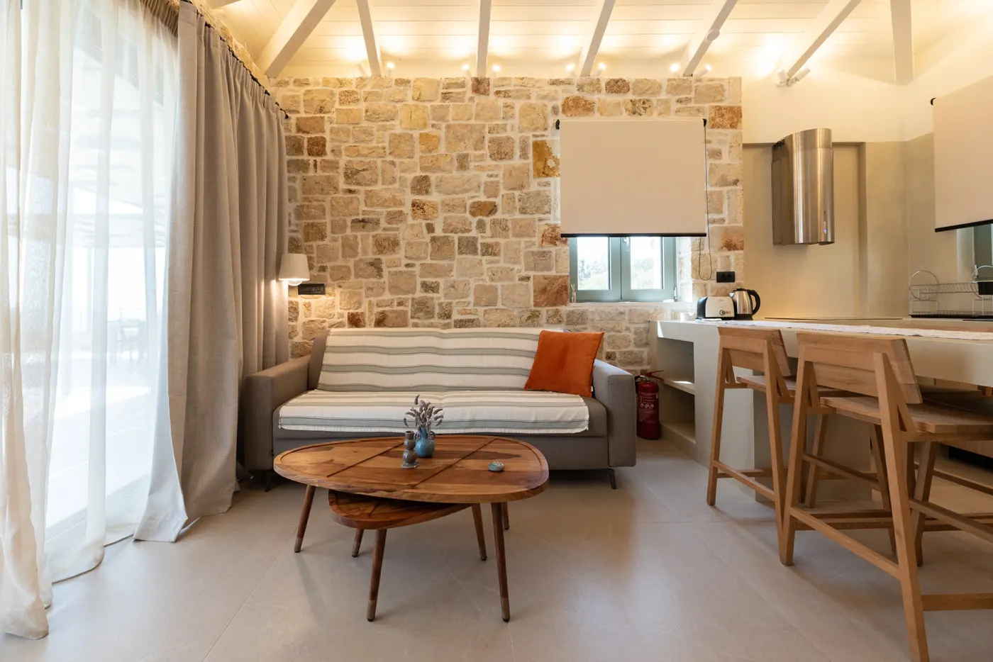 Stone living room and kitchen at Astir